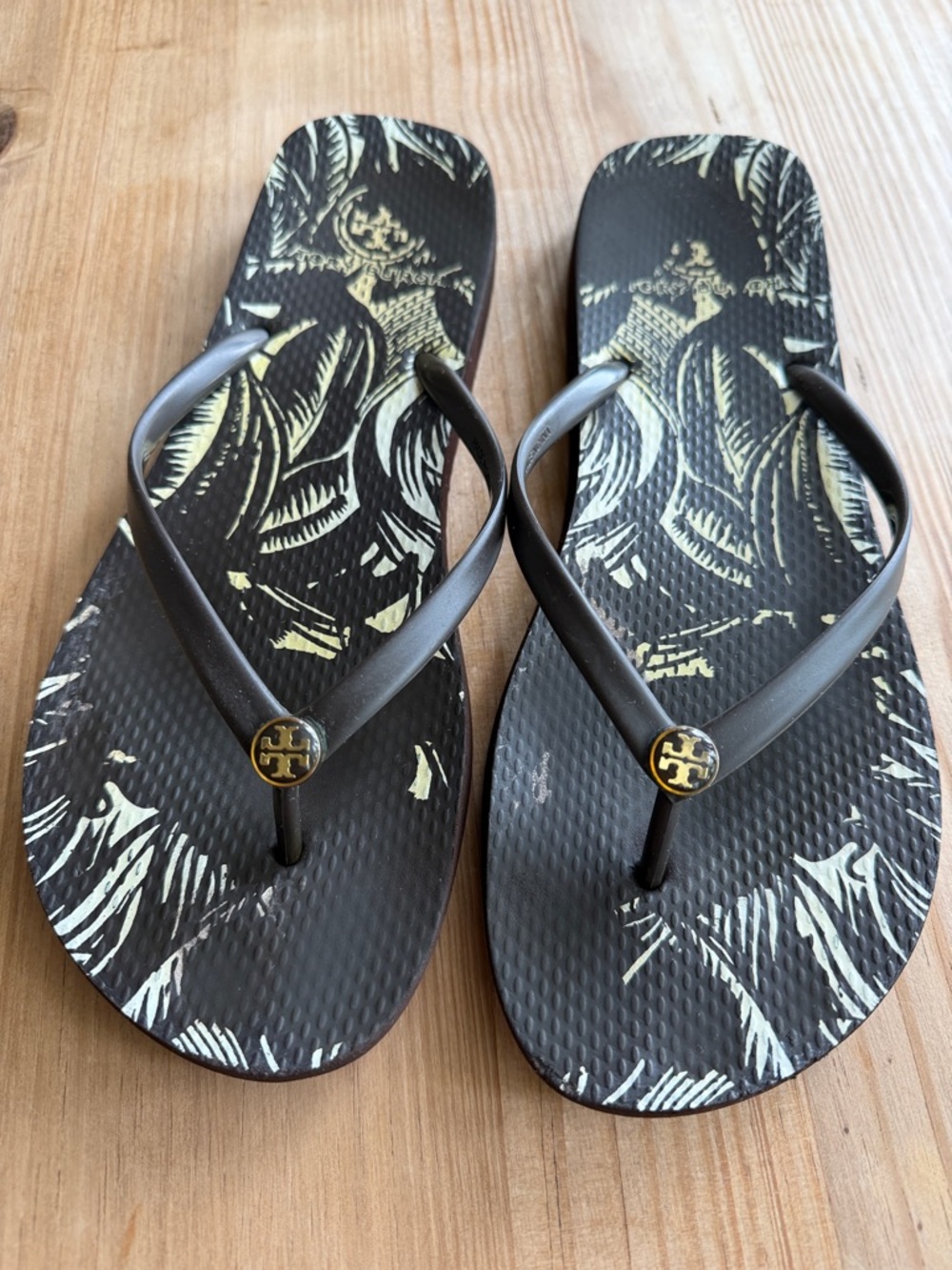 Tory Burch Brown Flip Flops with Cream Tropical Print and Gold Logo Medallions
